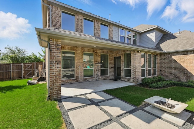 1617 Commons Way, Prosper, TX 75078 - rear view of property featuring brick siding, a patio area, and roof with shingles