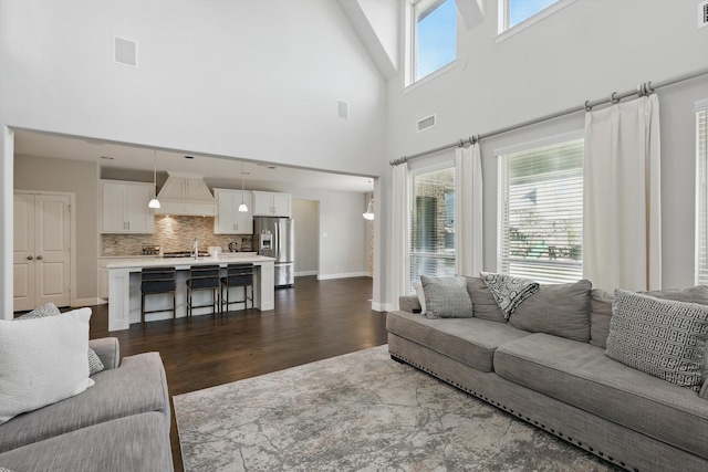 1617 Commons Way, Prosper, TX 75078 - living room featuring a towering ceiling and dark wood-style floors