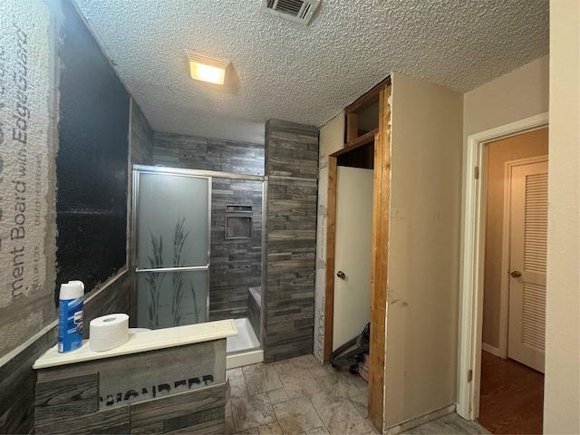 1909 Cloisters Dr Unit 1025, Arlington, TX 76011 - full bathroom with a shower stall, a textured ceiling, and wooden walls