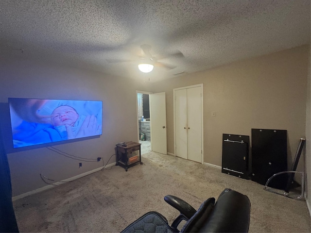 1909 Cloisters Dr Unit 1025, Arlington, TX 76011 - bedroom with carpet flooring, a textured ceiling, and a ceiling fan
