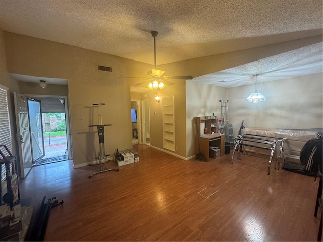 1909 Cloisters Dr Unit 1025, Arlington, TX 76011 - dining room featuring a textured ceiling, wood finished floors, and ceiling fan
