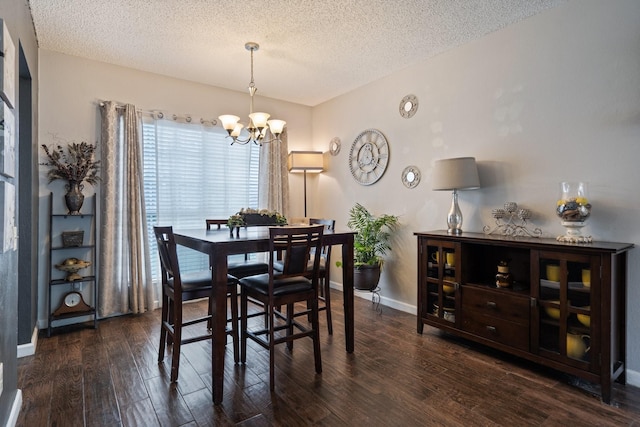 4443 Mercer St, Grand Prairie, TX 75052 - dining area with a chandelier, a textured ceiling, and wood finished floors