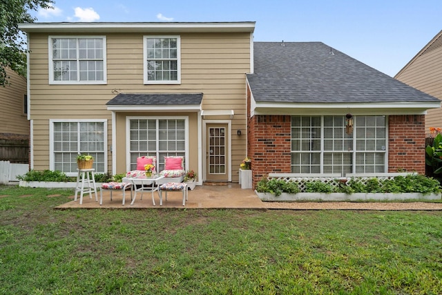 4443 Mercer St, Grand Prairie, TX 75052 - rear view of property featuring a shingled roof, a patio, brick siding, and a yard
