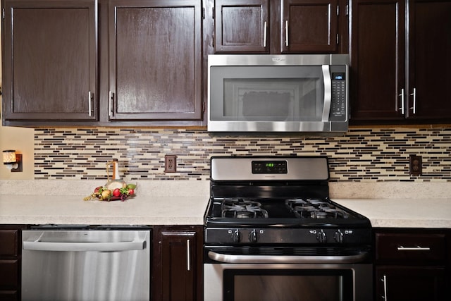 4443 Mercer St, Grand Prairie, TX 75052 - kitchen featuring appliances with stainless steel finishes, dark brown cabinetry, and light countertops