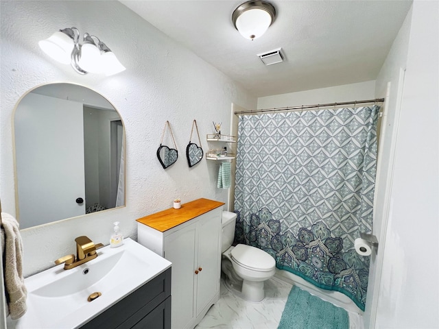 6828 Younger Dr, The Colony, TX 75056 - bathroom featuring vanity, marble finish floors, and a textured wall