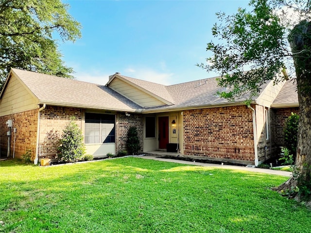 6828 Younger Dr, The Colony, TX 75056 - ranch-style house featuring brick siding, a front lawn, and a shingled roof