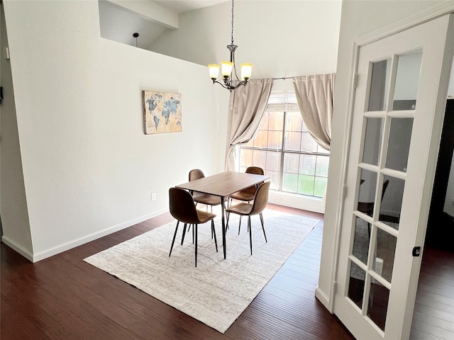 6828 Younger Dr, The Colony, TX 75056 - dining room featuring a chandelier, wood finished floors, and vaulted ceiling