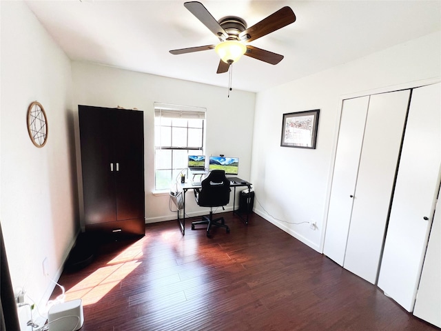 6828 Younger Dr, The Colony, TX 75056 - office area with dark wood finished floors and a ceiling fan