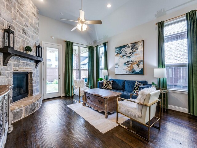 4141 Maclin Dr, Celina, TX 75009 - living room featuring ceiling fan, wood finished floors, vaulted ceiling, and a stone fireplace