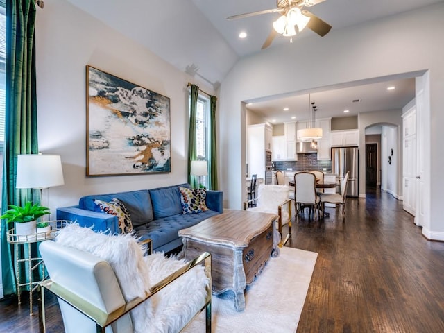 4141 Maclin Dr, Celina, TX 75009 - living area with a ceiling fan, dark wood-type flooring, arched walkways, recessed lighting, and vaulted ceiling