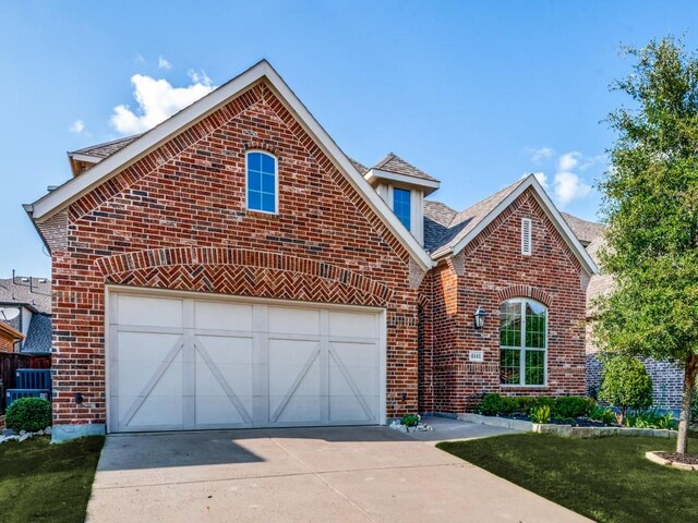 4141 Maclin Dr, Celina, TX 75009 - view of front of property with brick siding, concrete driveway, and a shingled roof
