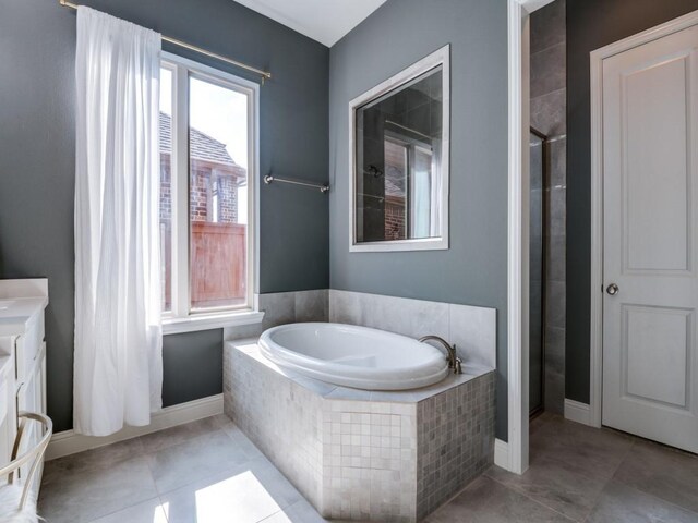 4141 Maclin Dr, Celina, TX 75009 - full bath featuring a garden tub, vanity, and tile patterned flooring