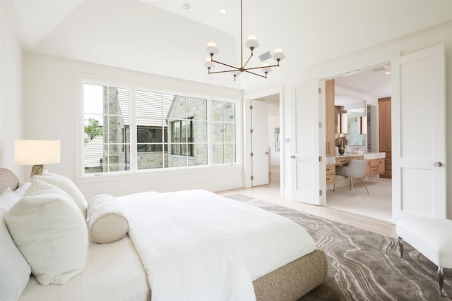 3725 Stratford Ave, Highland Park, TX 75205 - bedroom featuring a chandelier, lofted ceiling, and ensuite bathroom