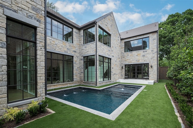 3725 Stratford Ave, Highland Park, TX 75205 - rear view of house featuring stone siding and an outdoor pool