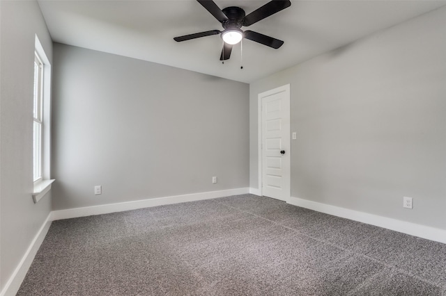 4131 Opal Ave, Dallas, TX 75216 - unfurnished room with dark carpet and a ceiling fan