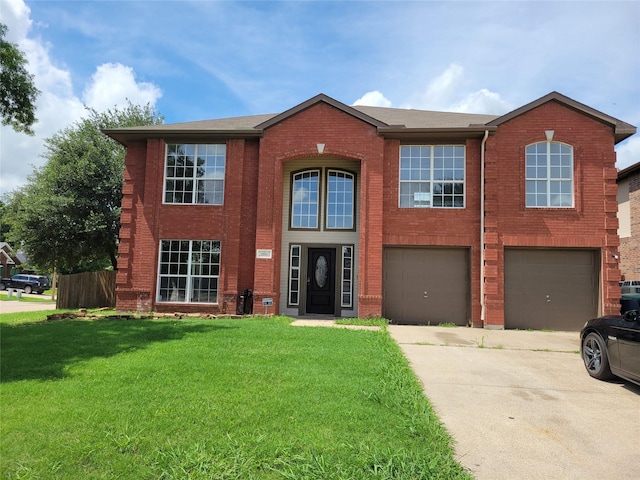 2001 Mark Twain Ln, Denton, TX 76210 - view of front of home with driveway, brick siding, an attached garage, and a front yard