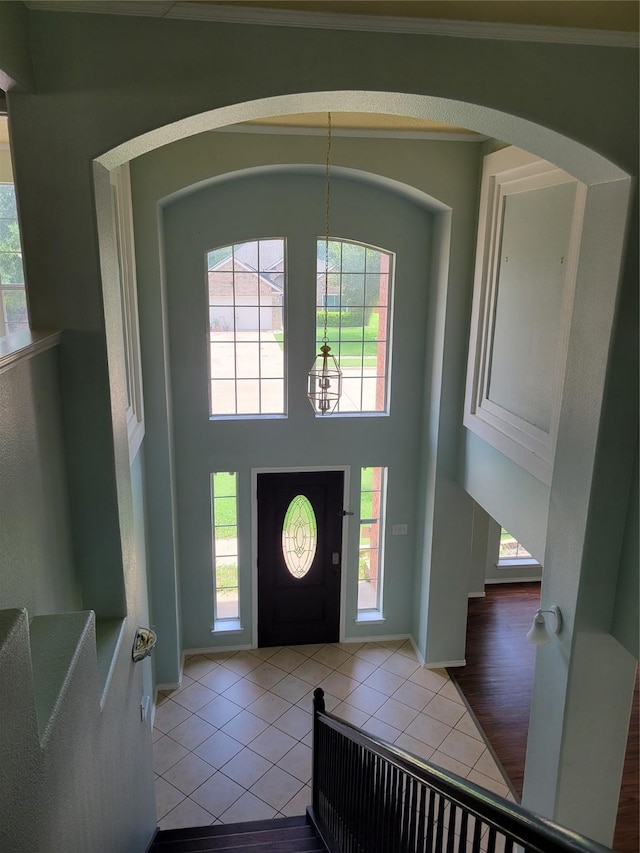 2001 Mark Twain Ln, Denton, TX 76210 - entrance foyer with a chandelier, a towering ceiling, tile patterned floors, arched walkways, and stairway