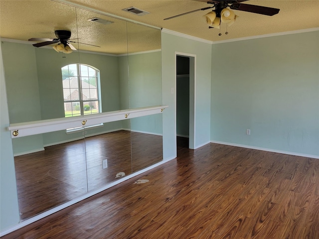 2001 Mark Twain Ln, Denton, TX 76210 - spare room featuring ceiling fan, a textured ceiling, wood finished floors, and crown molding
