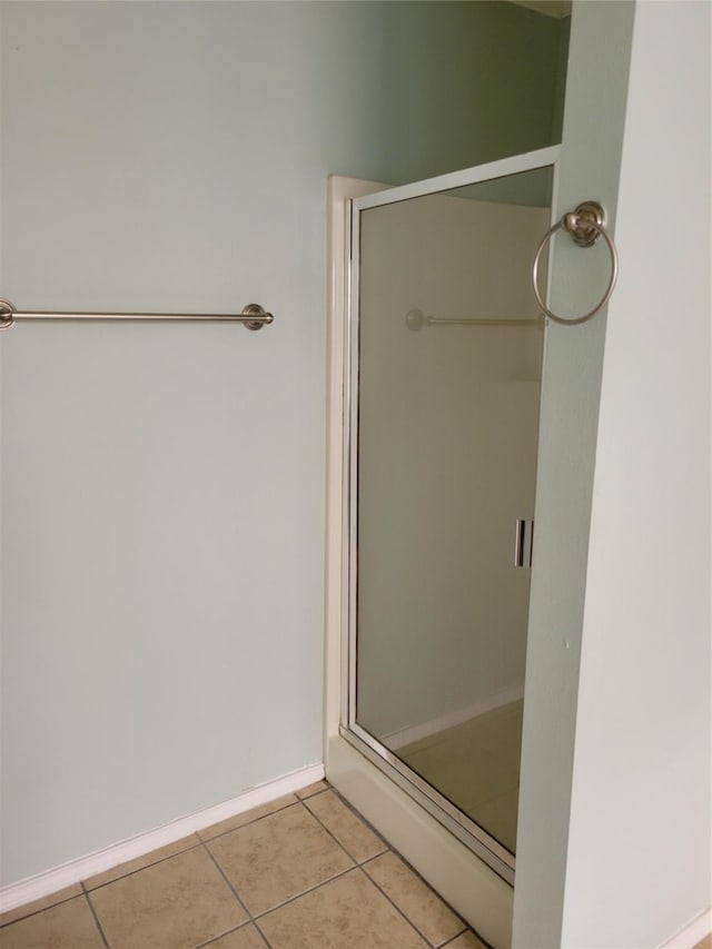 2001 Mark Twain Ln, Denton, TX 76210 - full bathroom with a stall shower and tile patterned floors