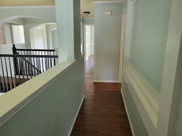 2001 Mark Twain Ln, Denton, TX 76210 - corridor featuring crown molding, dark wood-style floors, an upstairs landing, and arched walkways