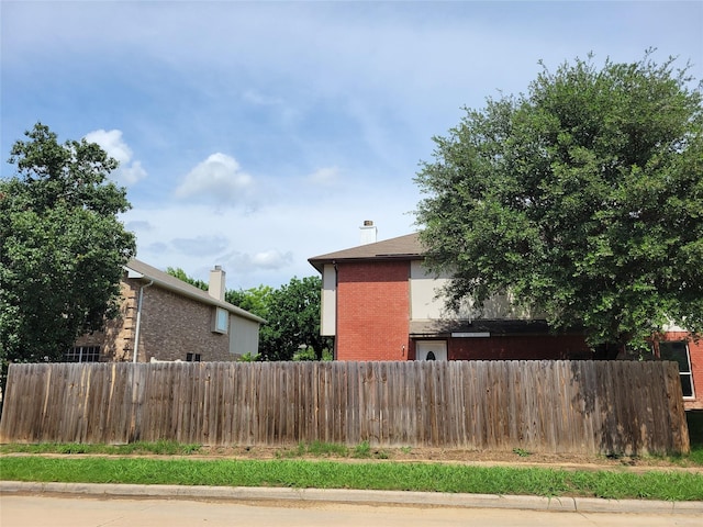 2001 Mark Twain Ln, Denton, TX 76210 - view of home's exterior featuring brick siding