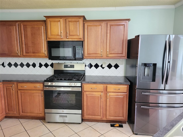 2001 Mark Twain Ln, Denton, TX 76210 - kitchen with appliances with stainless steel finishes, dark countertops, brown cabinets, light tile patterned flooring, and crown molding