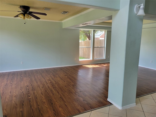 2001 Mark Twain Ln, Denton, TX 76210 - empty room featuring crown molding, ceiling fan, and wood finished floors