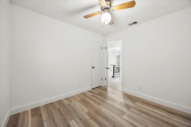 2207 English Dr, Garland, TX 75041 - unfurnished room featuring light wood-style flooring and a ceiling fan
