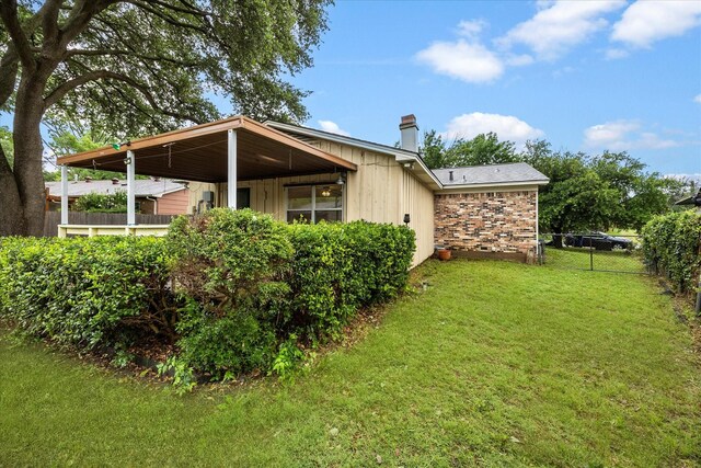 2207 English Dr, Garland, TX 75041 - view of property exterior featuring a chimney and board and batten siding