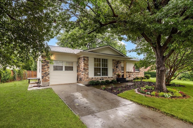 2207 English Dr, Garland, TX 75041 - view of front of home with brick siding and driveway