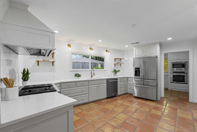 6805 Benito Ct, Fort Worth, TX 76126 - kitchen with stainless steel appliances, open shelves, custom exhaust hood, decorative backsplash, and recessed lighting