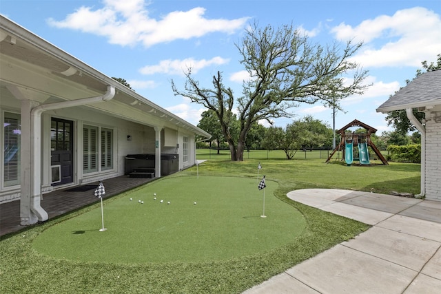 6805 Benito Ct, Fort Worth, TX 76126 - view of yard with a putting green, a hot tub, a patio, and a playground