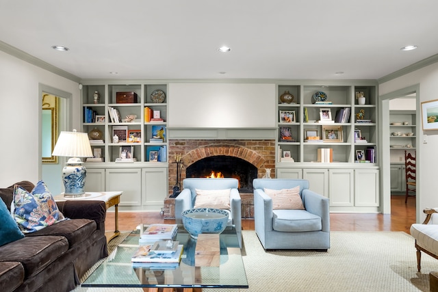 6710 Meadowcreek Dr, Dallas, TX 75254 - living room featuring crown molding, a fireplace, recessed lighting, built in shelves, and wood finished floors
