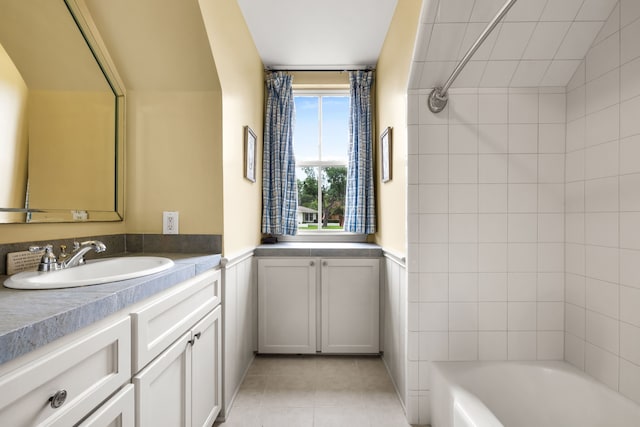 6710 Meadowcreek Dr, Dallas, TX 75254 - bathroom with vanity, tile patterned floors, and bathing tub / shower combination