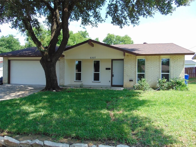 6207 Misty Wood Dr, Dallas, TX 75217 - single story home featuring brick siding, an attached garage, driveway, and a front yard