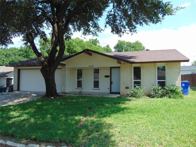 6207 Misty Wood Dr, Dallas, TX 75217 - single story home featuring brick siding, an attached garage, a front yard, and concrete driveway