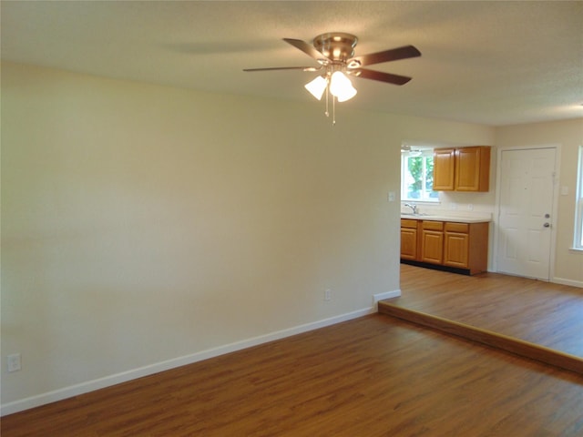 6207 Misty Wood Dr, Dallas, TX 75217 - unfurnished living room featuring light wood-type flooring and a ceiling fan