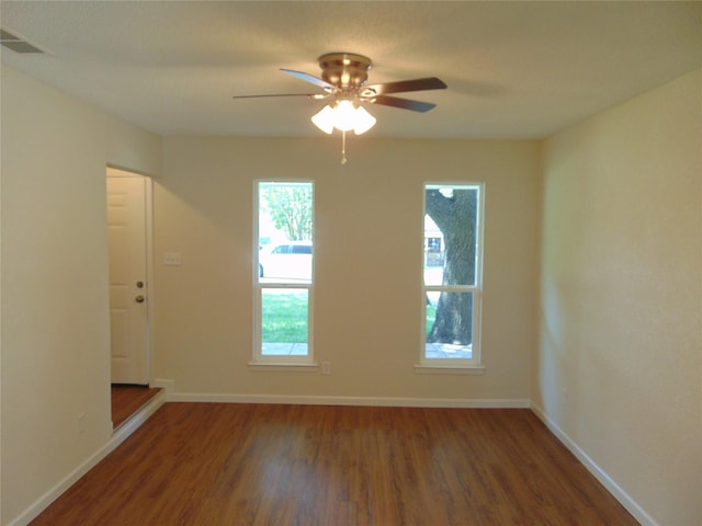 6207 Misty Wood Dr, Dallas, TX 75217 - unfurnished room with wood finished floors and ceiling fan