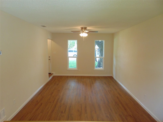 6207 Misty Wood Dr, Dallas, TX 75217 - empty room featuring wood finished floors and a ceiling fan