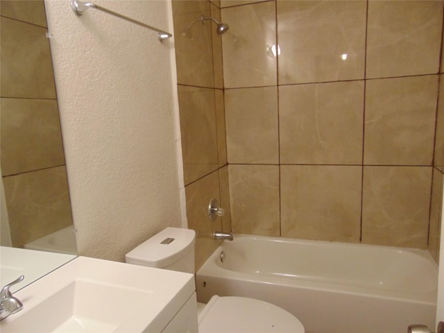 6207 Misty Wood Dr, Dallas, TX 75217 - bathroom featuring a textured wall, vanity, and shower / bath combination