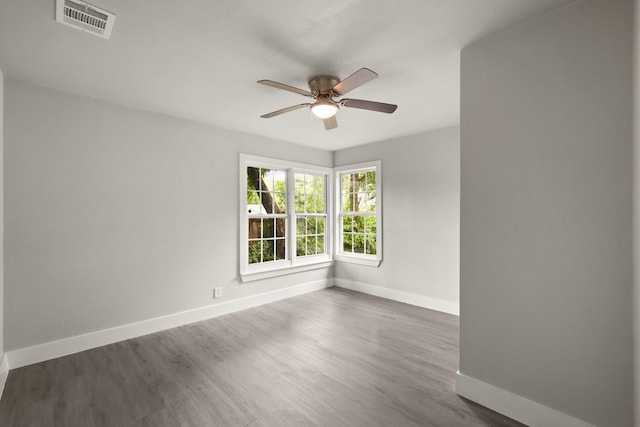 3624 Baylor St, Fort Worth, TX 76119 - empty room featuring ceiling fan and dark wood-style floors