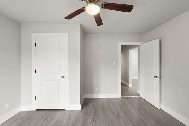 3624 Baylor St, Fort Worth, TX 76119 - unfurnished bedroom featuring wood finished floors and a ceiling fan