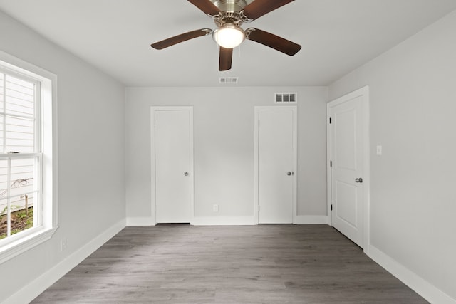 3624 Baylor St, Fort Worth, TX 76119 - unfurnished bedroom with wood finished floors and ceiling fan