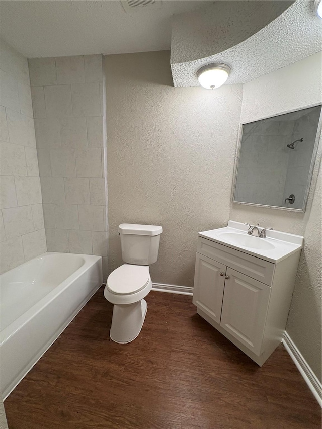 2209 Viewtop Ln Unit 2, Arlington, TX 76012 - full bathroom with vanity, wood finished floors, bathtub / shower combination, and a textured wall