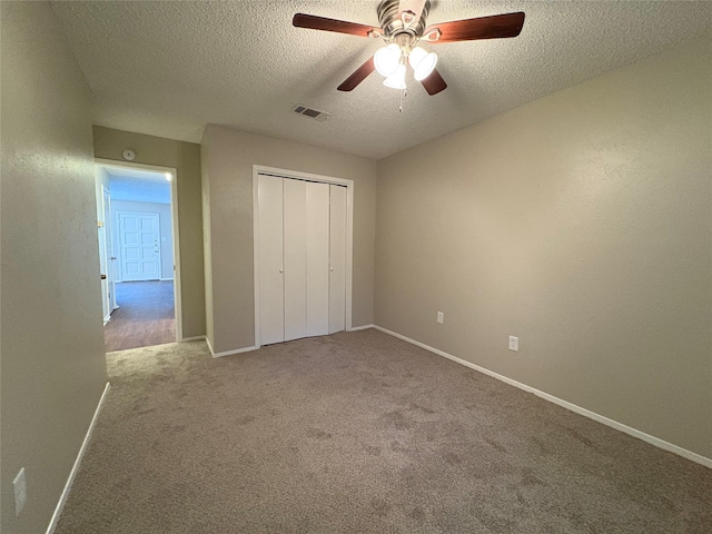 2209 Viewtop Ln Unit 2, Arlington, TX 76012 - unfurnished bedroom featuring a textured ceiling, carpet floors, a closet, and ceiling fan