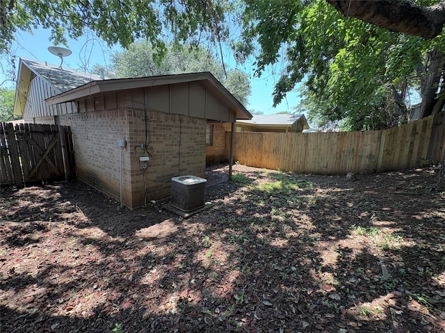 2209 Viewtop Ln Unit 2, Arlington, TX 76012 - view of side of property featuring brick siding, a fenced backyard, and board and batten siding