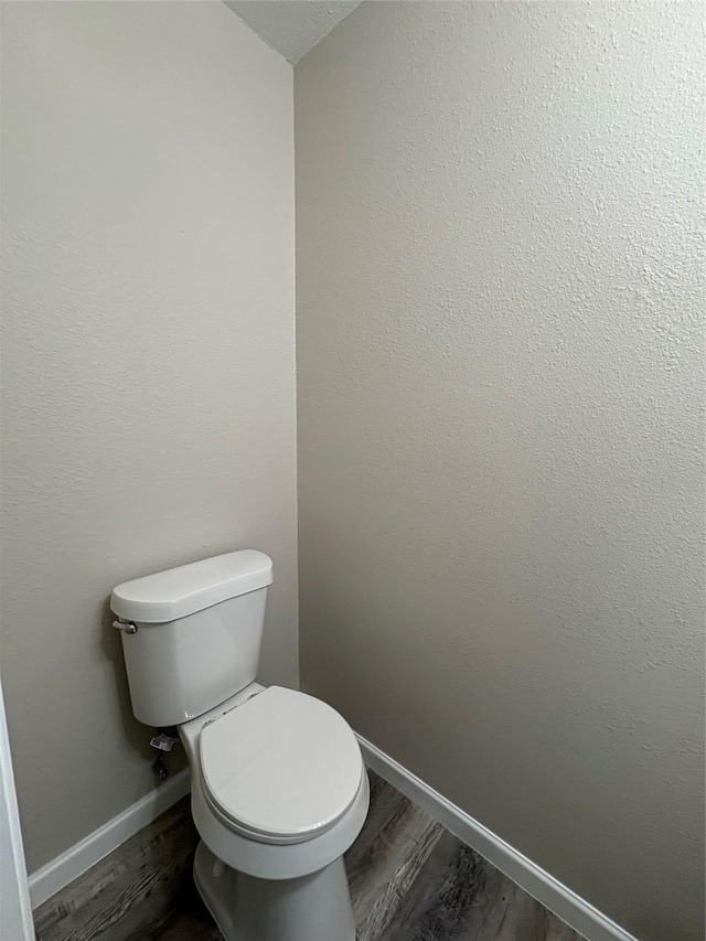 2209 Viewtop Ln Unit 2, Arlington, TX 76012 - bathroom featuring toilet and wood finished floors