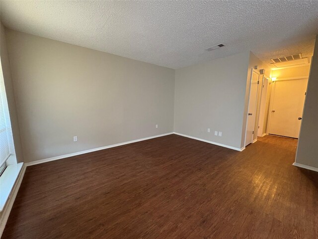 2209 Viewtop Ln Unit 2, Arlington, TX 76012 - unfurnished room with dark wood finished floors and a textured ceiling