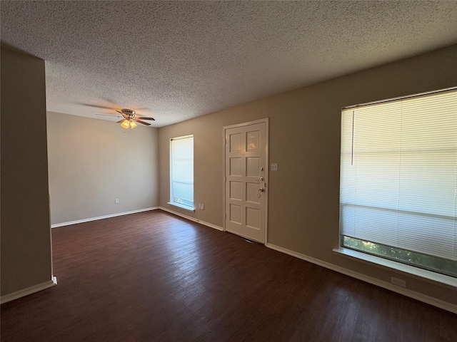 2209 Viewtop Ln Unit 2, Arlington, TX 76012 - entryway with dark wood-type flooring, a ceiling fan, and a textured ceiling