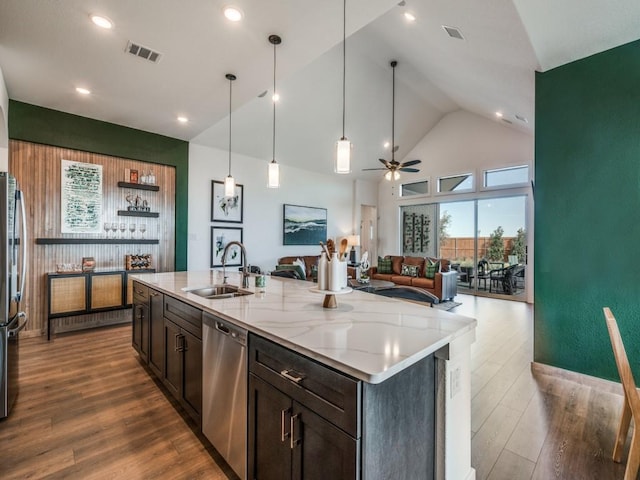 1887 Silver Birch Rd, Waxahachie, TX 75165 - kitchen with stainless steel appliances, high vaulted ceiling, ceiling fan, light stone counters, and open floor plan